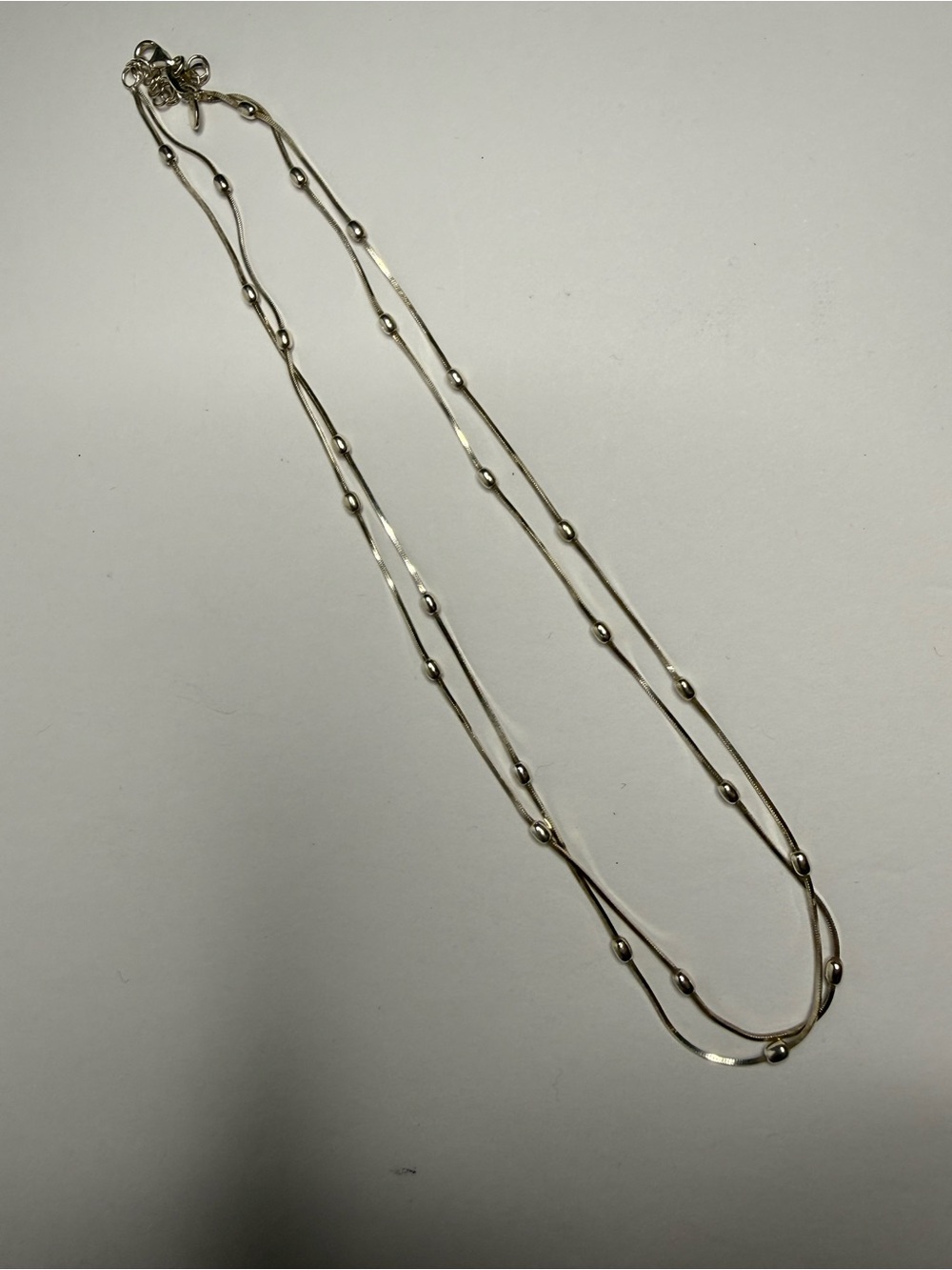 Dyadema sterling silver double-strand satellite chain necklace.
